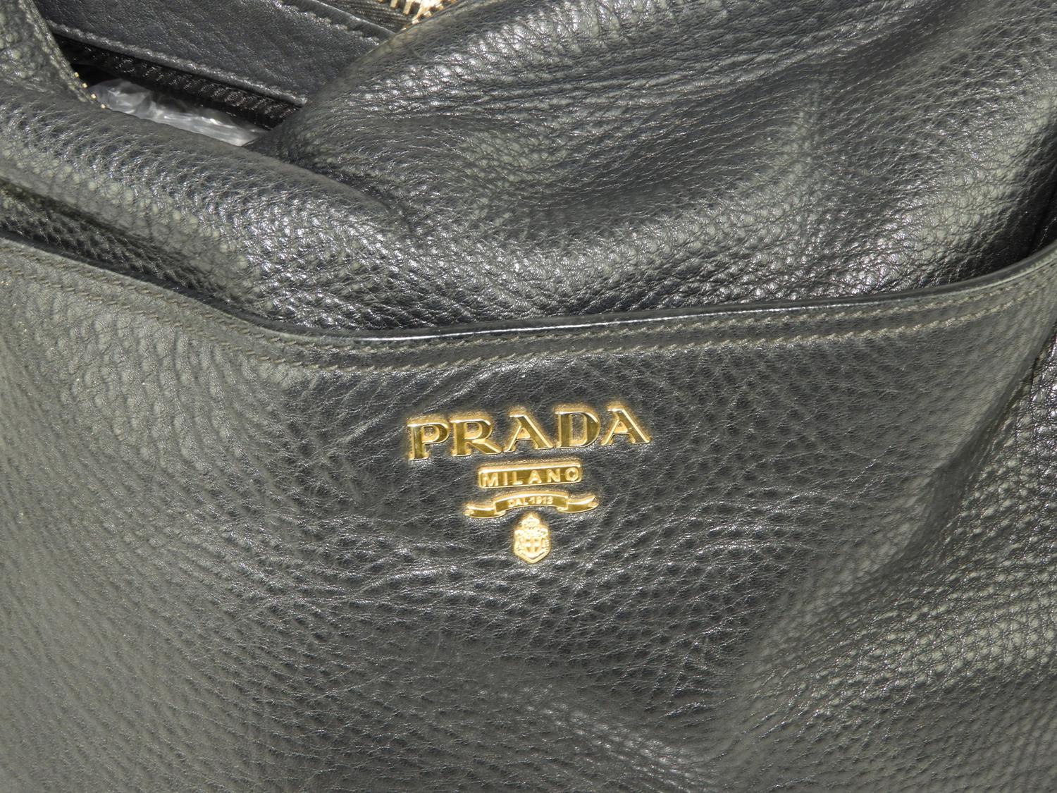 Murrays Auctioneers - Lot 115: Leather Prada purse, with cards